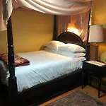 A Secluded Bedroom With A Private Full Bathroom