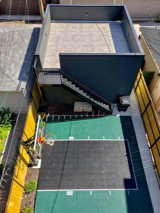 Urban Mansion Featuring A Rooftop City, Views, And Basketball Court