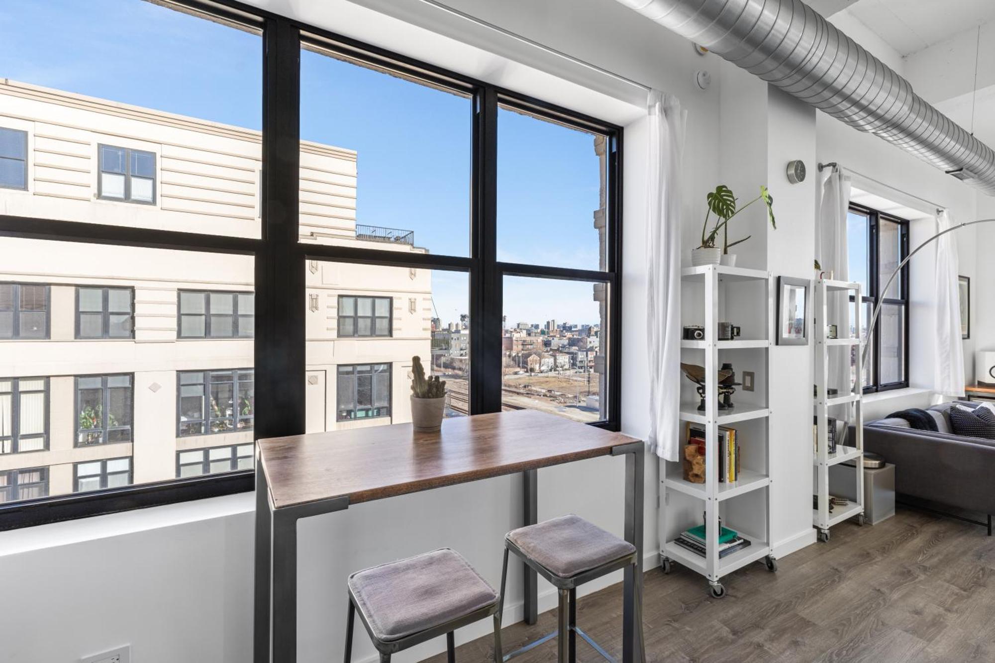 Modern Historic Loft 19ft Ceilings, Gym, Heated Parking, Skyline Views, Balcony *