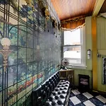 The Twin Lions: Bespoke Travel Lodge W/ Speakeasy*