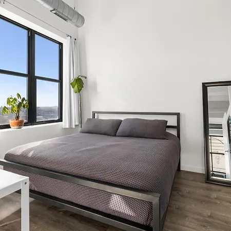 Modern Historic Loft 19ft Ceilings, Gym, Heated Parking, Skyline Views, Balcony